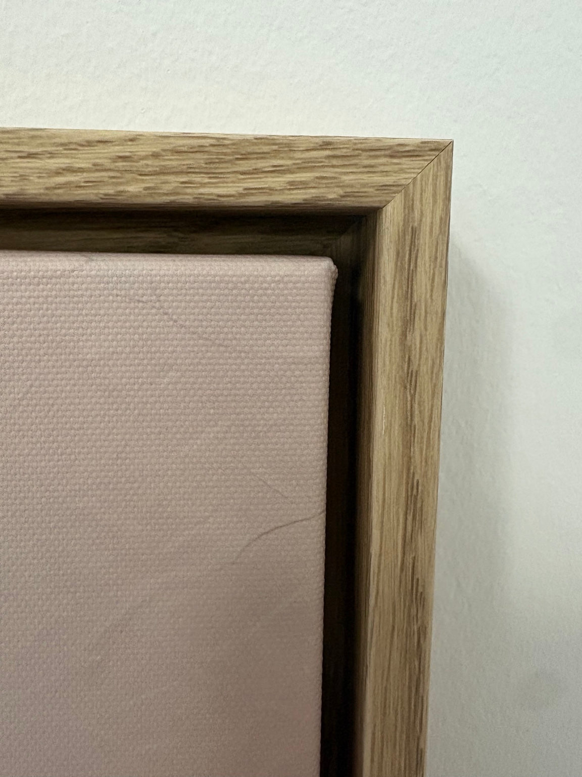 Original CNVS light oak floating-frame corner photograph — finish detail shown on sample artwork